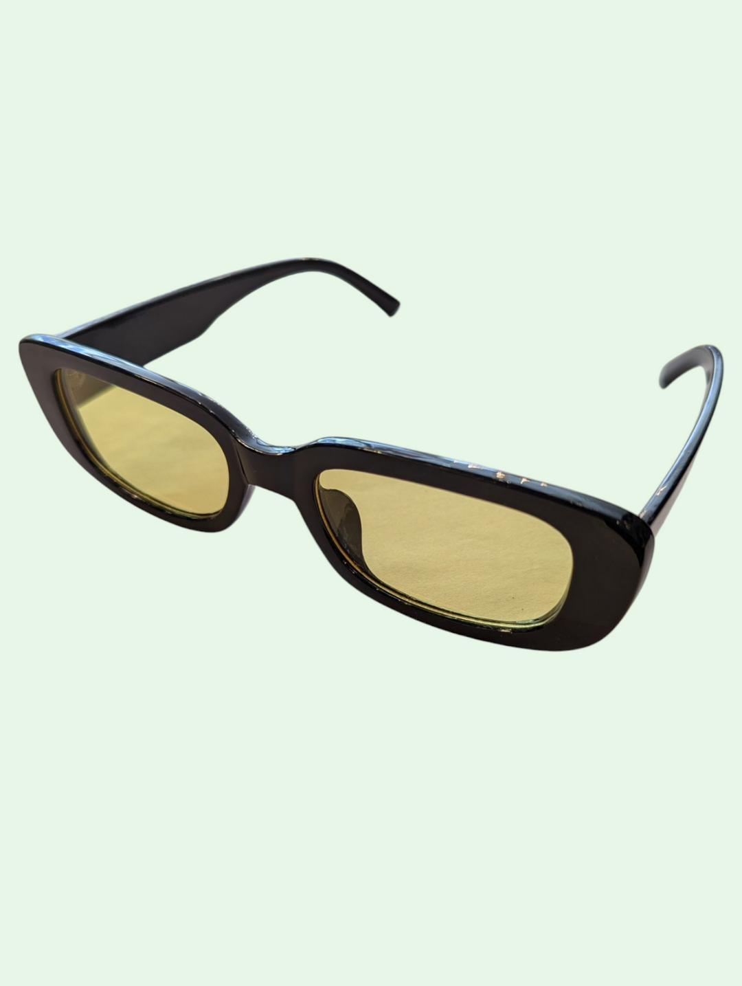 a studio shot of the adele glasses showing the yellow lenses