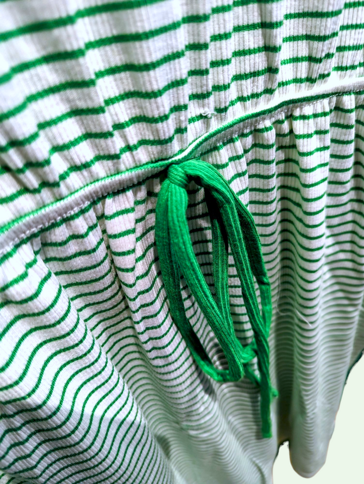 a close up view of the tie on the waist of the stripe minidress