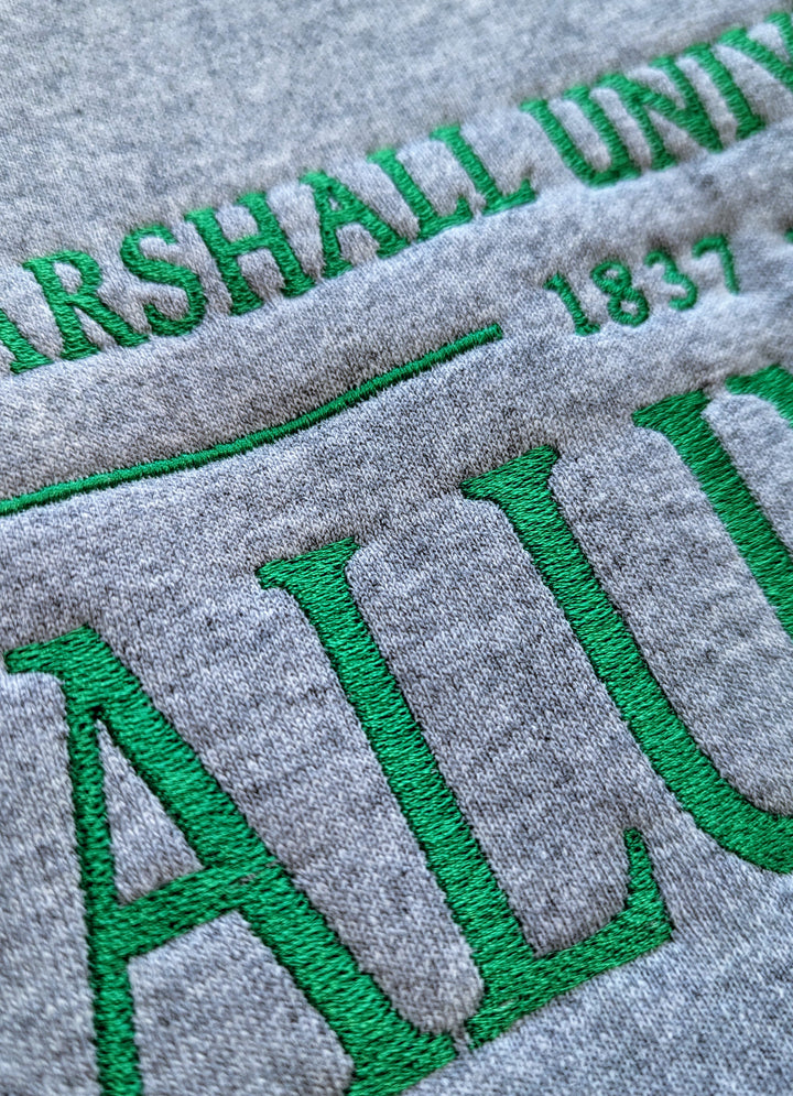 close up detail to see the texture of the stitching in the alumni sweatshirt