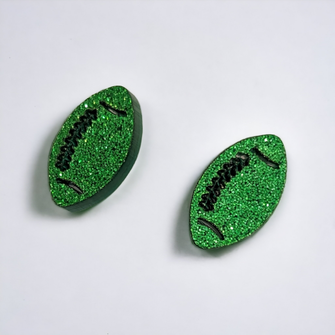 glittery green acrylic football shaped earrings