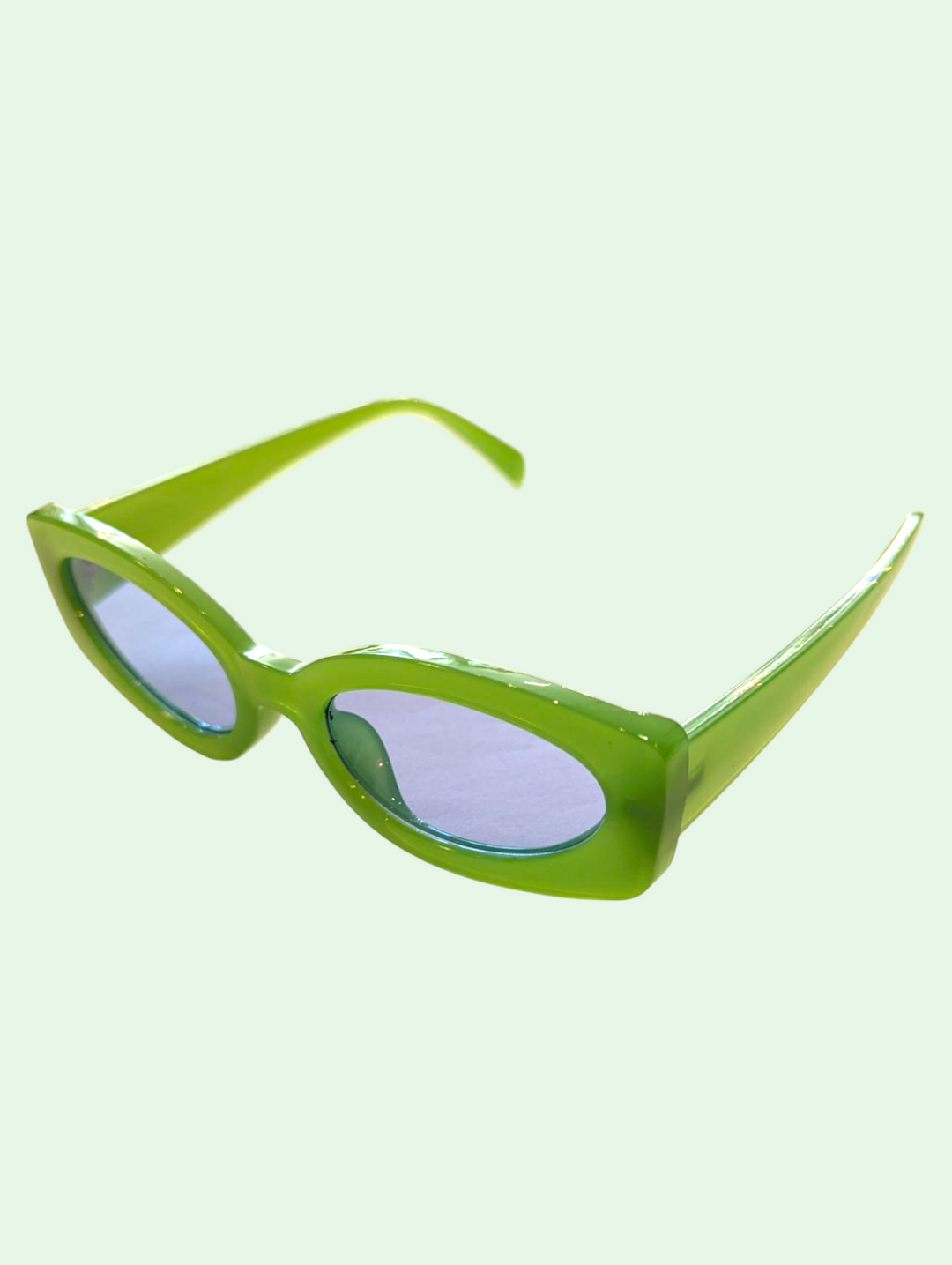 a studio shot of the milk green sunglasses