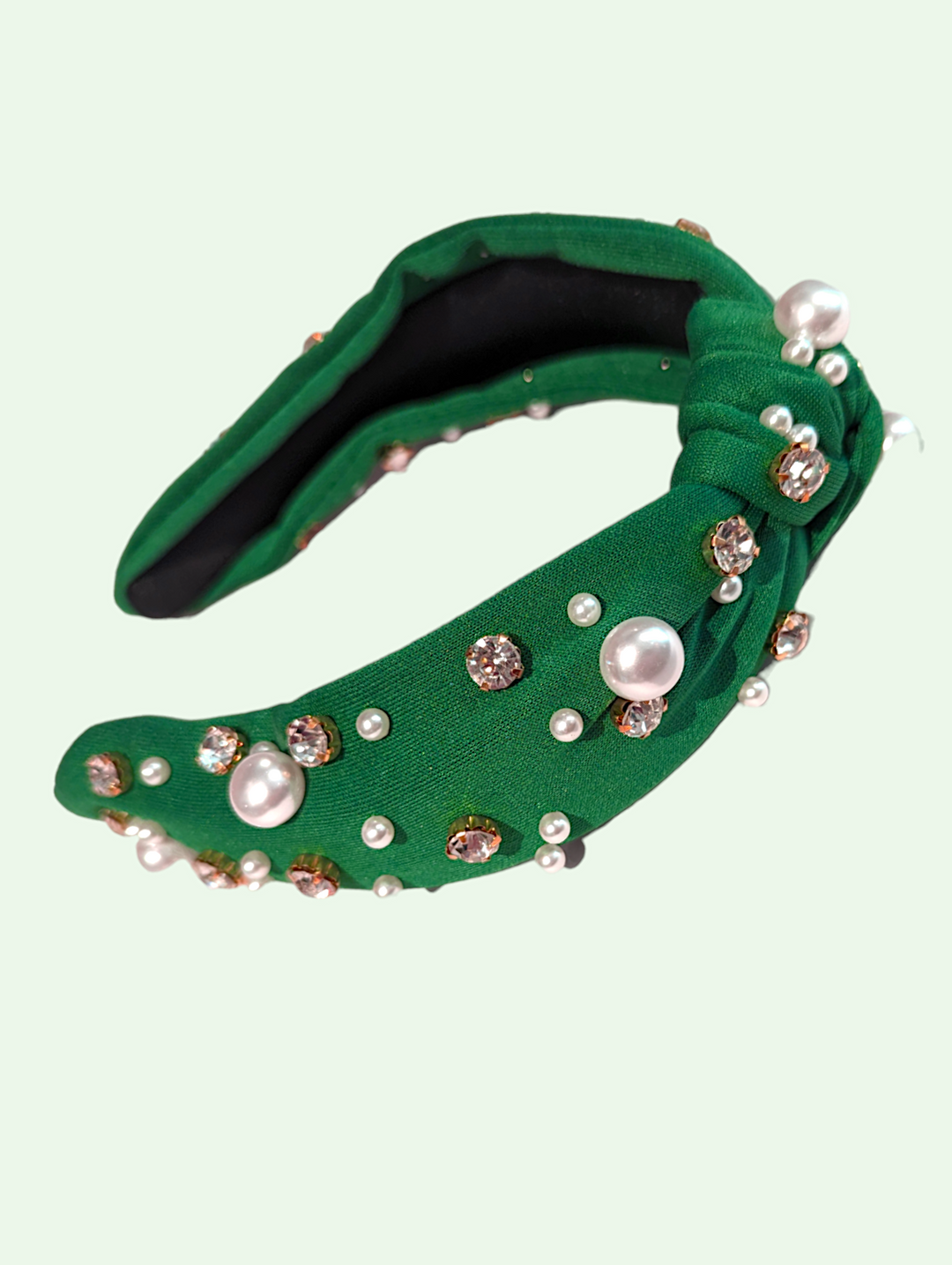 studio shot of the green  headband with pearls and rhinestones