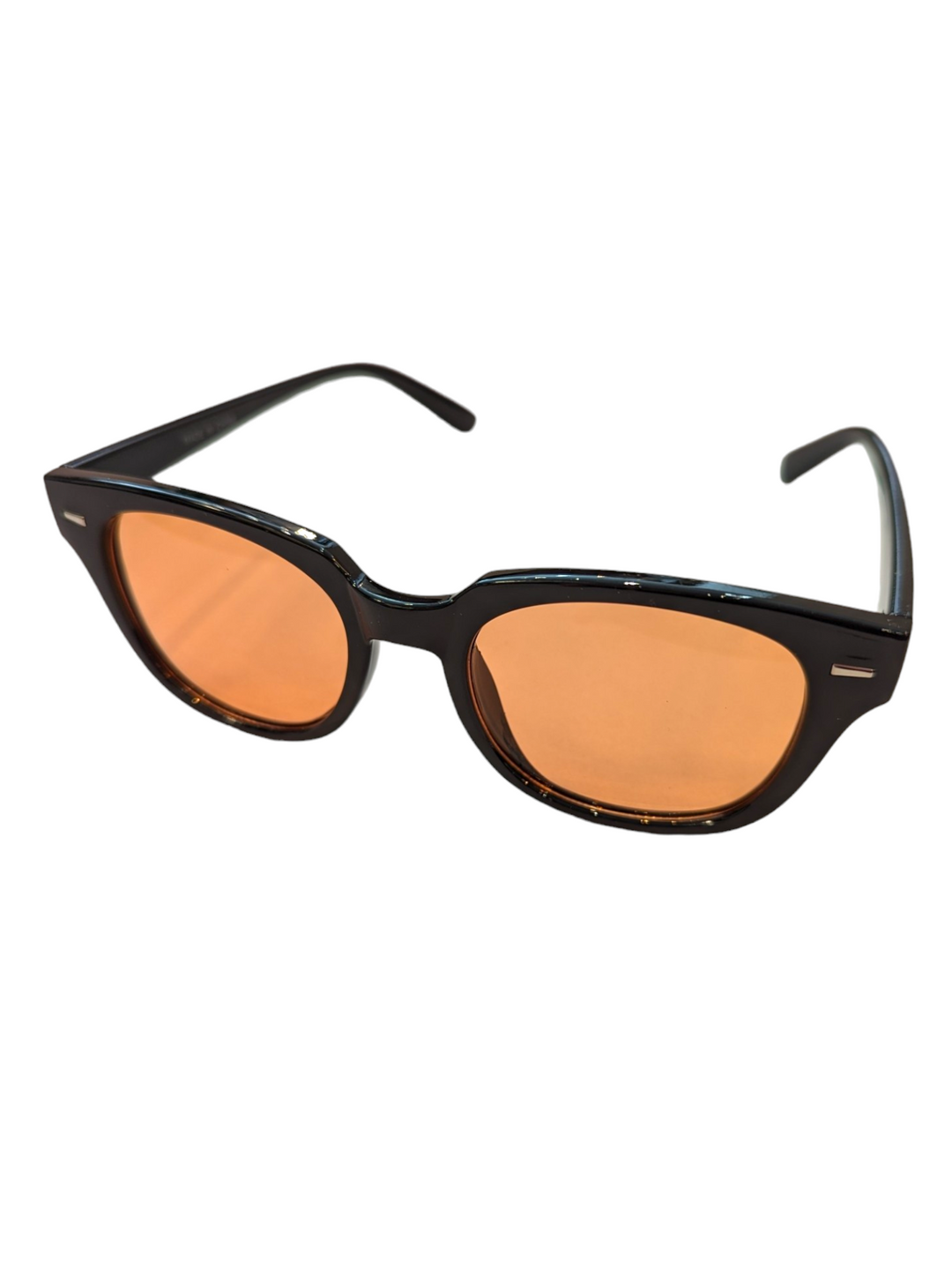 the perfect vacation sunglasses with black frames and peach lenses