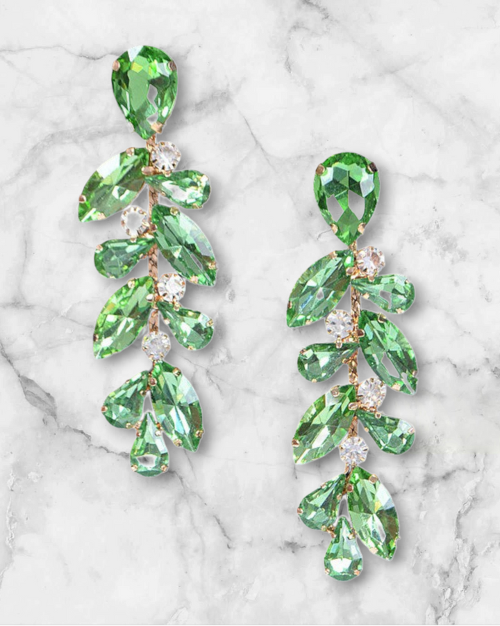 Rhinestone Floral Drop Earrings on a marble surface