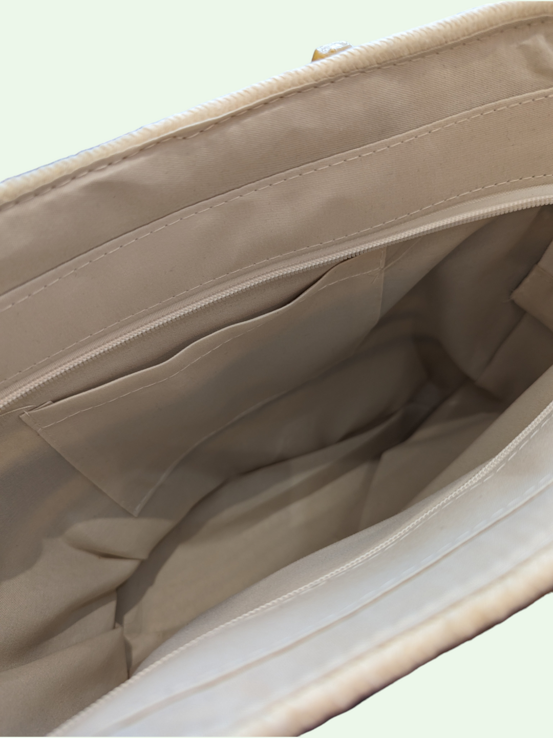 an inside view of the tote bag showing us the lining and the slip pocket