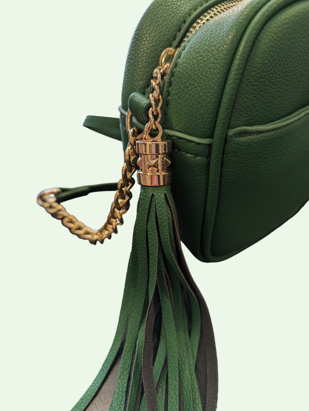 a close up of the tassel on the crossbody bag