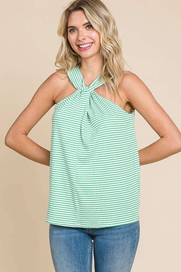 a blonde model shows us the front of the twist tank top