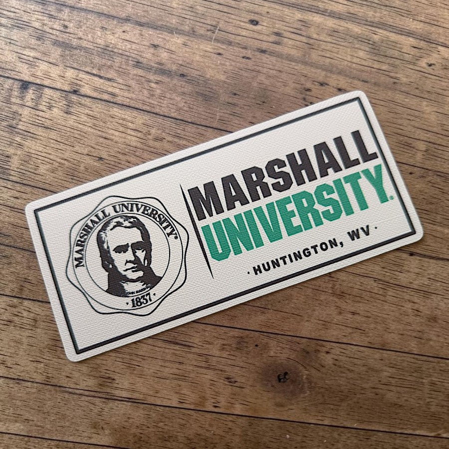a john marshall sticker on a wooden surface