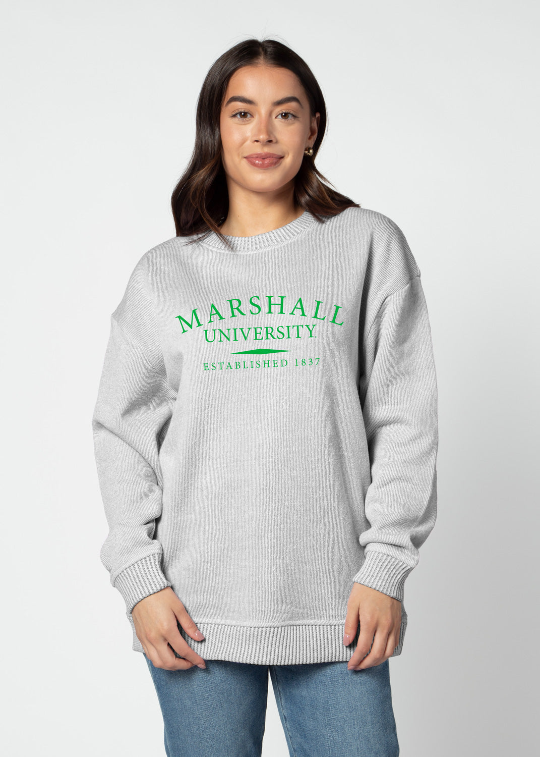a model faces the camera wearing a pullover sweater reading Marshall university established 1837
