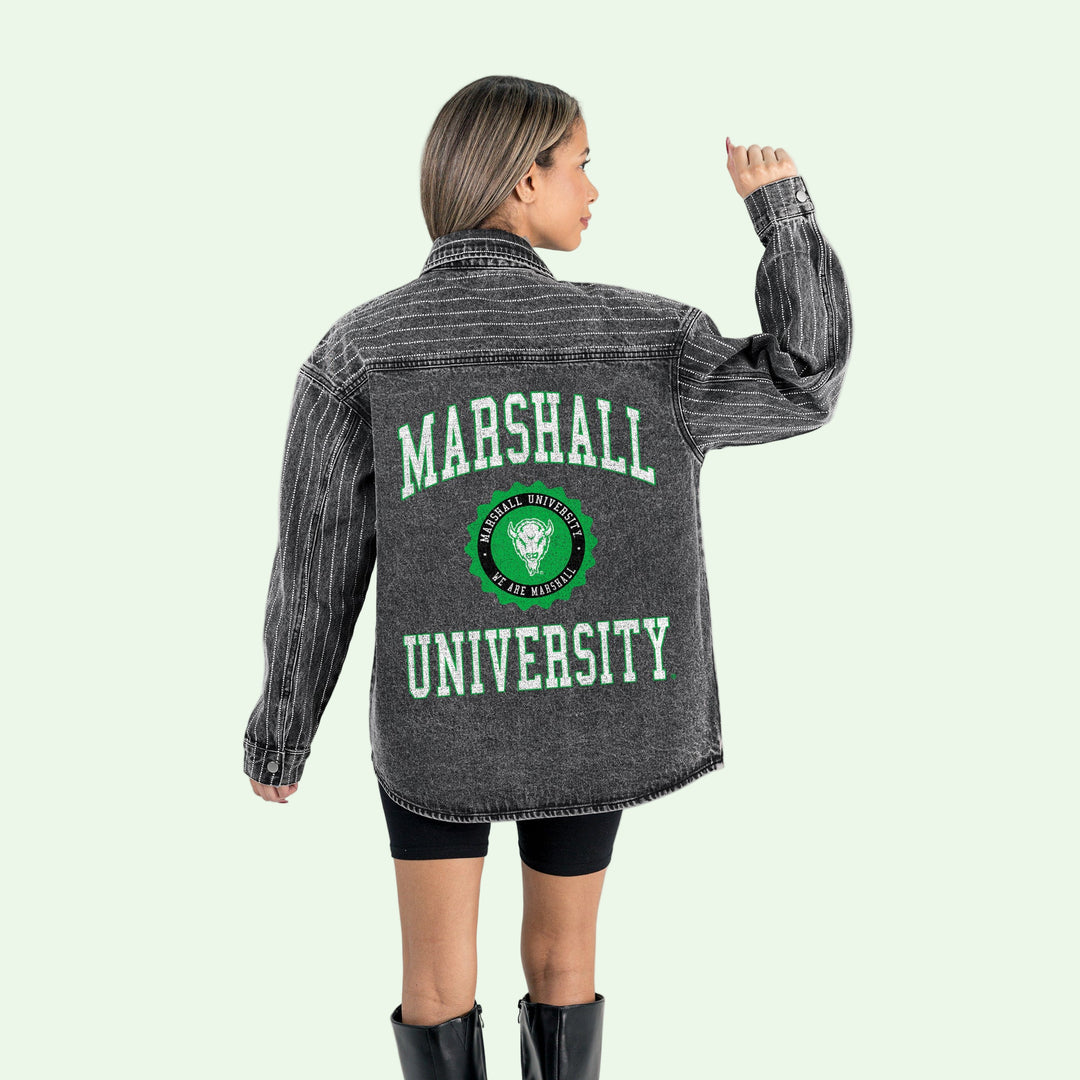 Person wearing a gray denim jacket with 'Marshall University' printed on the back, standing against a white background.