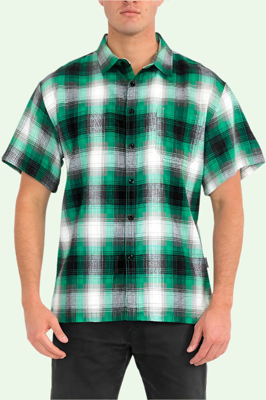 a male model shows us the plaid dad shirt in an aggressive, front facing stance. calm down, dude.