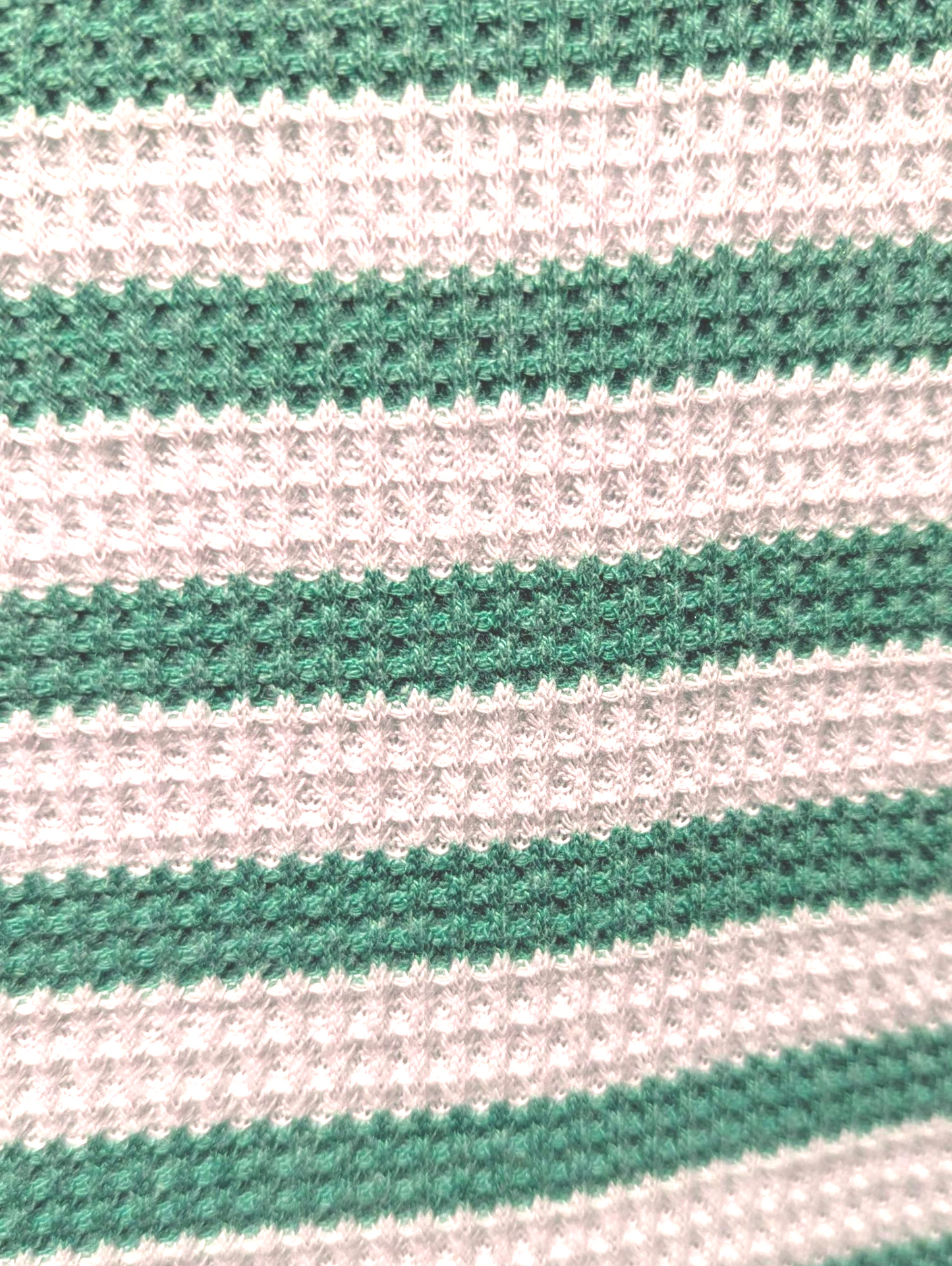 Close-up of green and white striped fabric texture