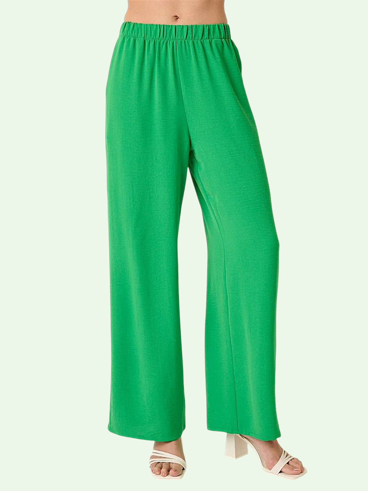 Green wide-leg pants on a white background