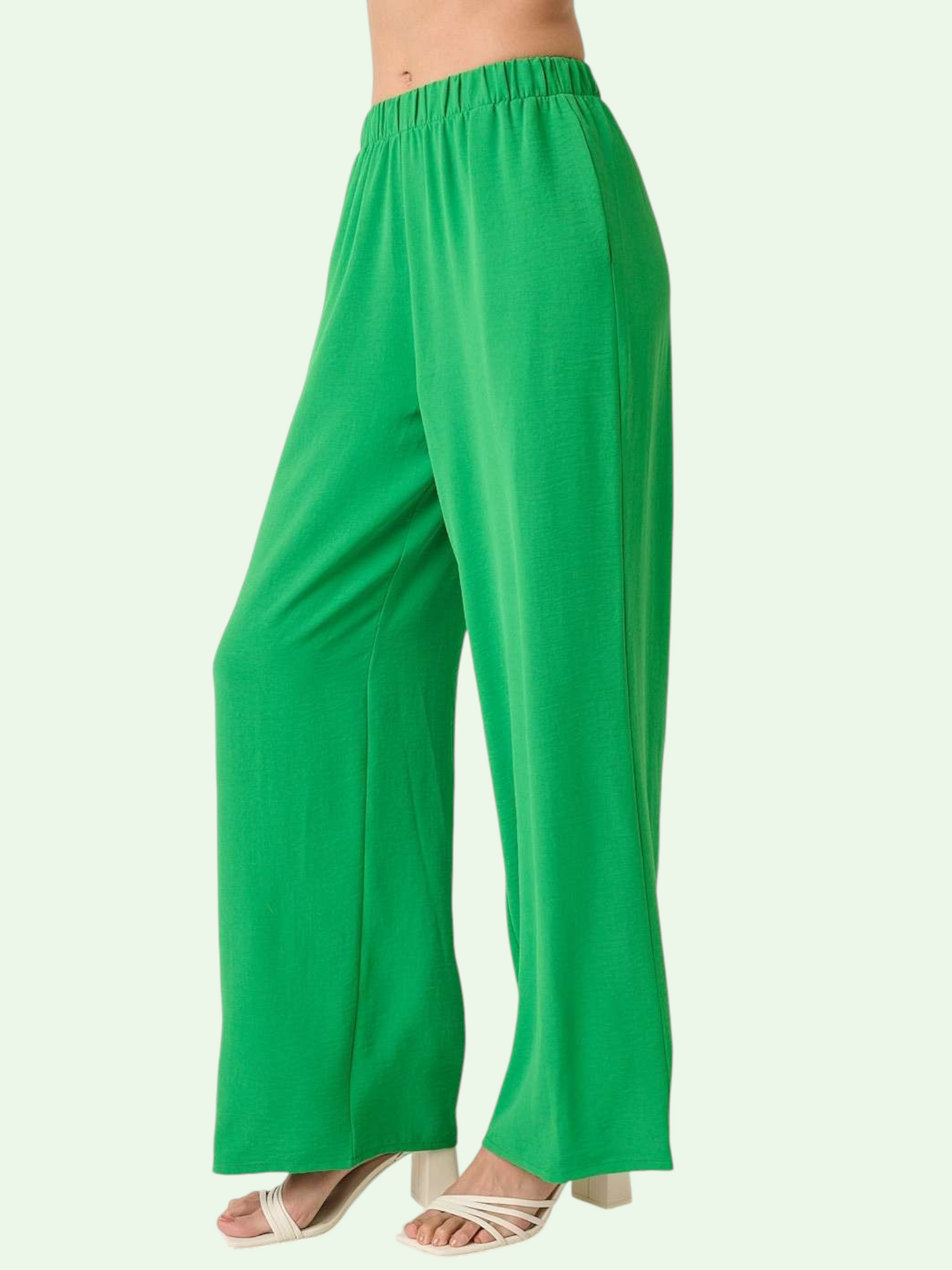 Green wide-leg pants on a white background