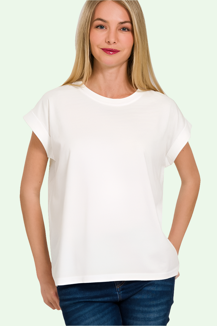 a blonde model shows us the front of the misses size white tee