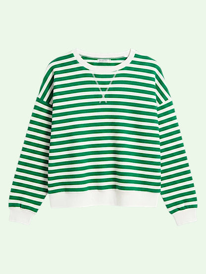 A green and white horizontally striped long-sleeve crewneck sweatshirt with white ribbed cuffs and hem, displayed against a pale mint green background.