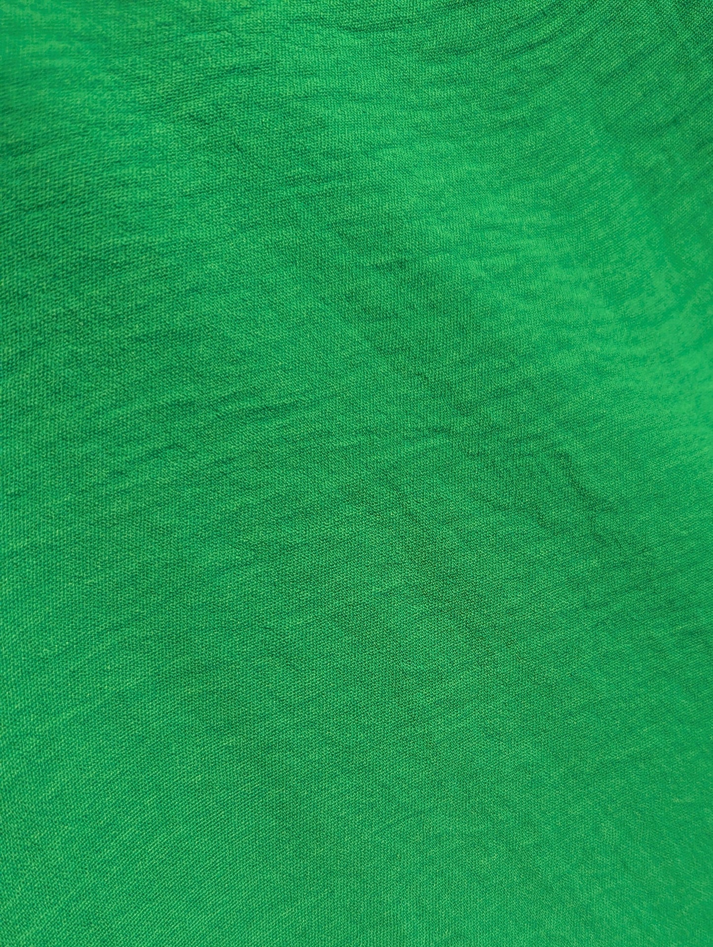 Close-up of green fabric with a visible texture