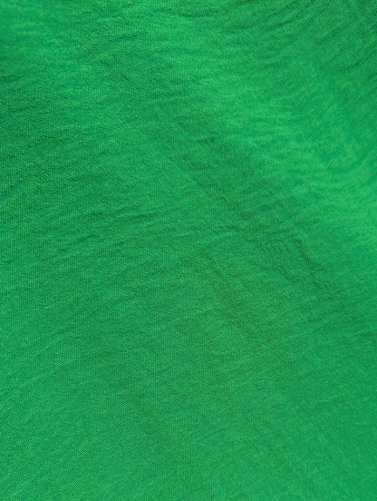 Close-up of green fabric with a visible texture