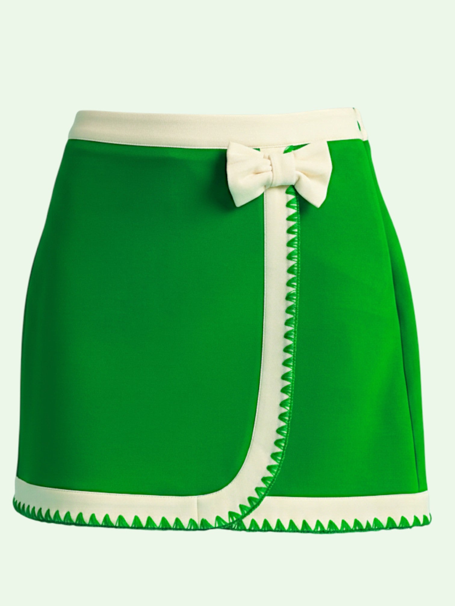 Green skirt with white trim and bow on a light gray background