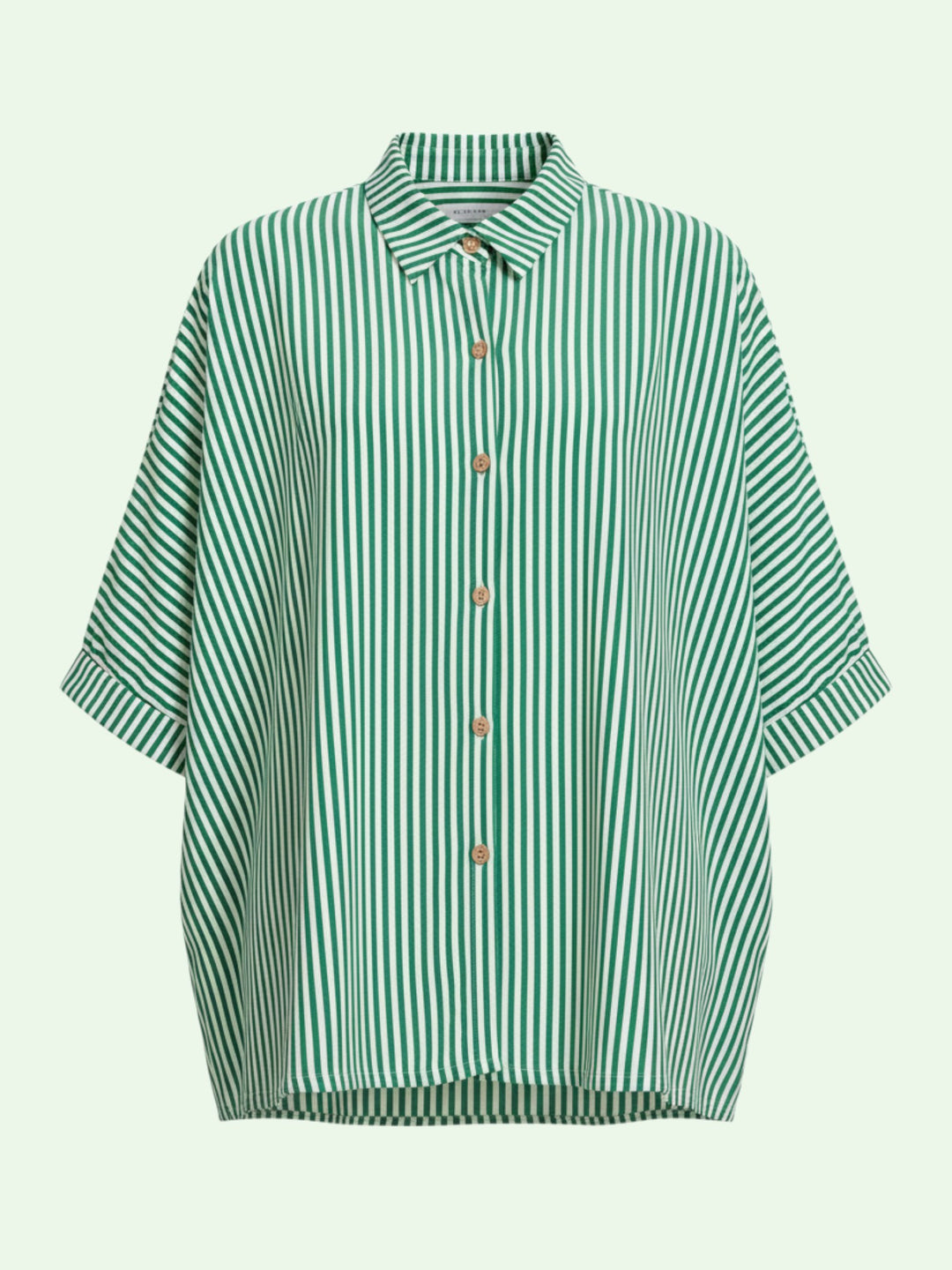 Green and white striped shirt on a light green background