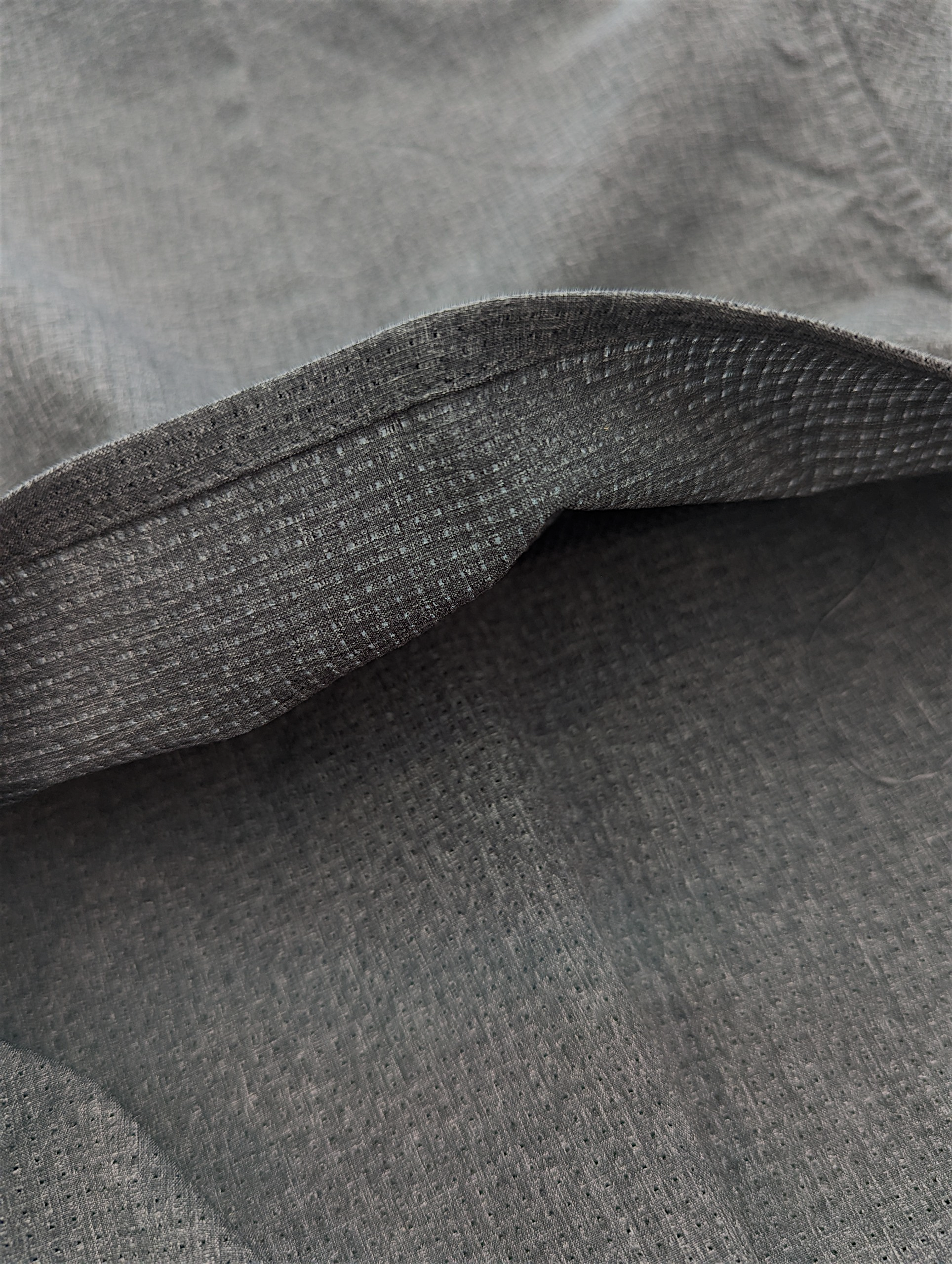 Close-up of gray fabric with a textured pattern