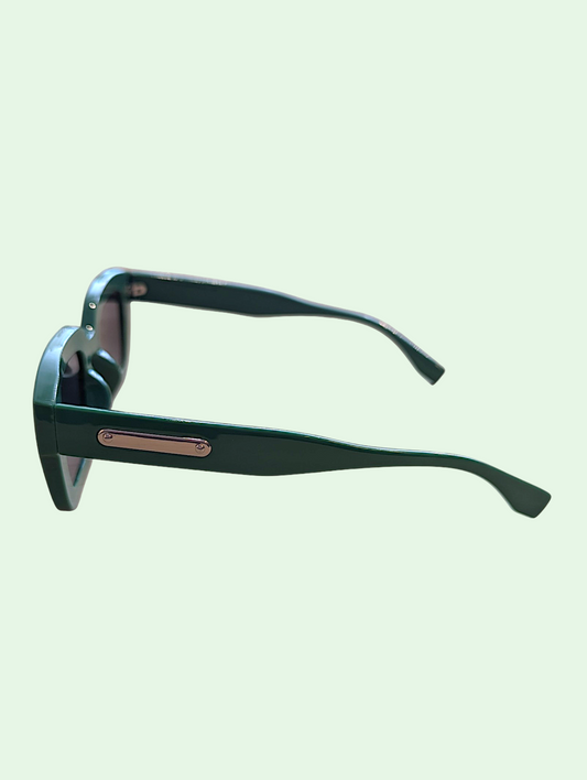 Sunglasses with black frame and rose gold accents on a light green background