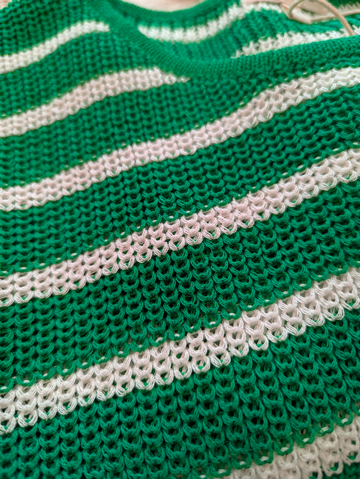 Close-up of a green and white striped fabric texture