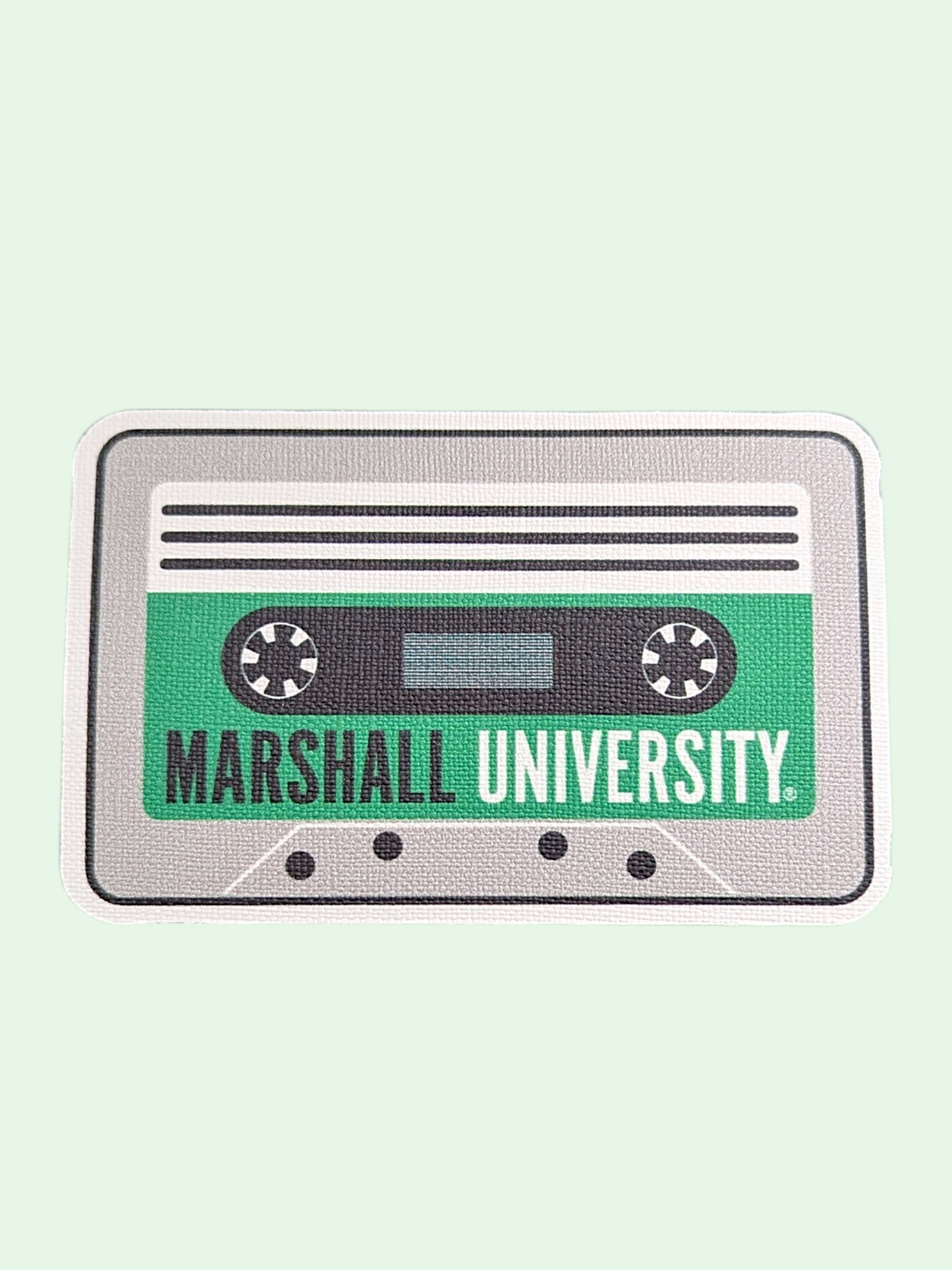 Patch of a cassette tape with 'Marshall University' text on a light green background