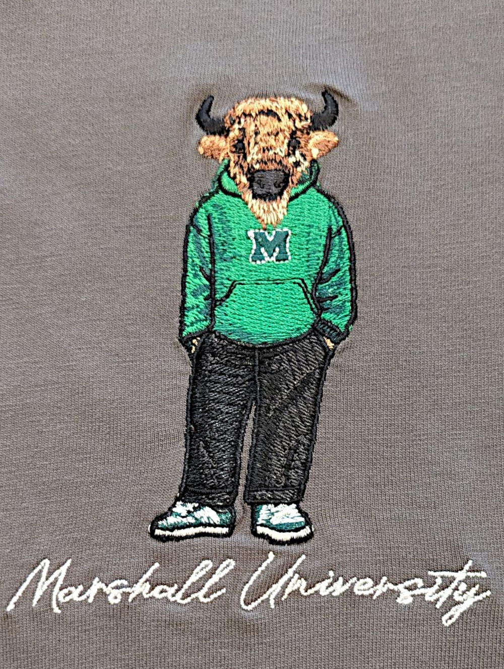 Embroidered design of a bison wearing a green hoodie with 'M' logo on a gray background, featuring 'Marshall University' text.