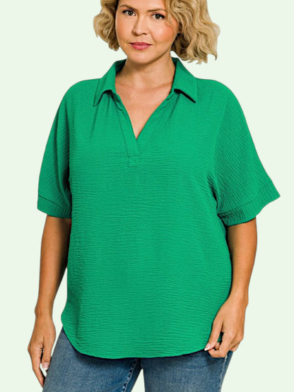 Woman wearing a green short-sleeve shirt on a white background