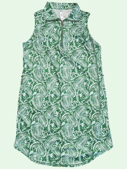 A sleeveless green and white paisley print dress with a half-zip collar, shown against a solid pale green background.