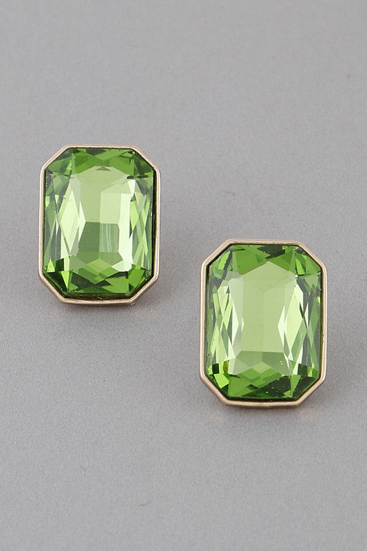 Light green emerald cut glass earrings in gold settings. 