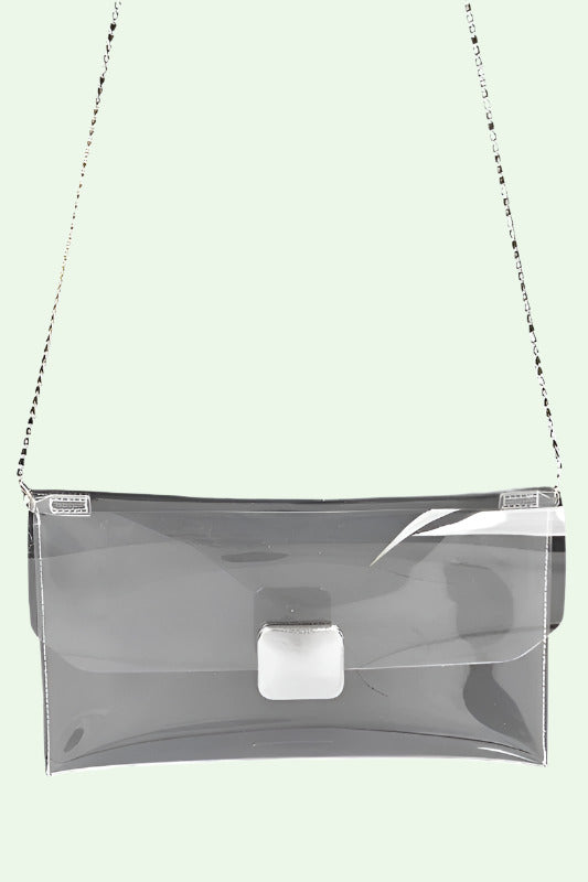 Clear plastic handbag with chain strap on a white background