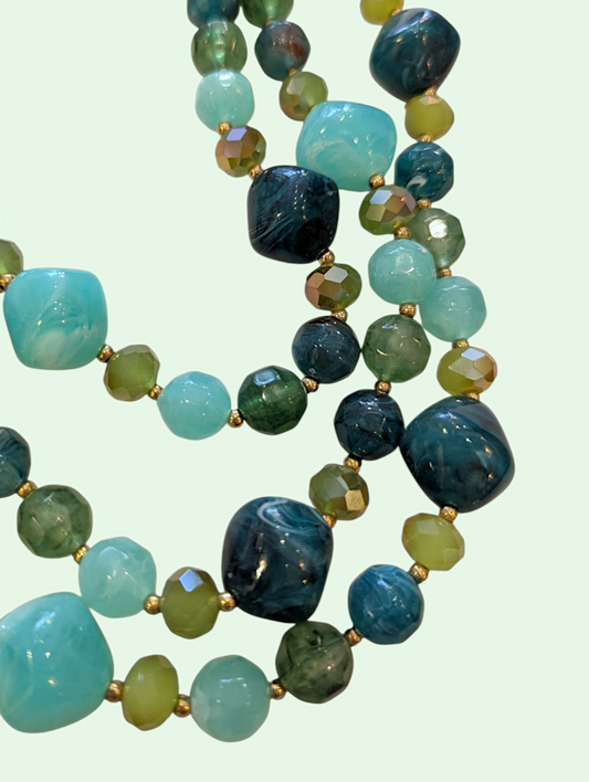 a detail shot of the green and blue beads on the erica necklace