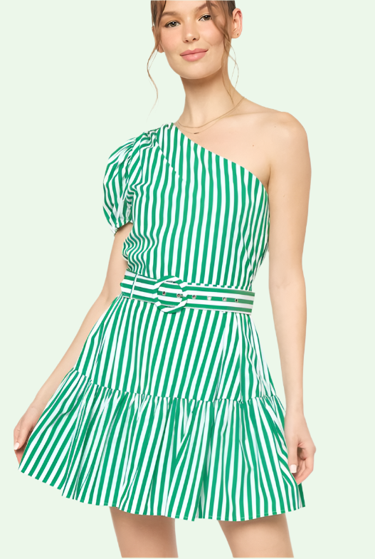 Woman wearing a green and white striped one-shoulder dress on a light green background