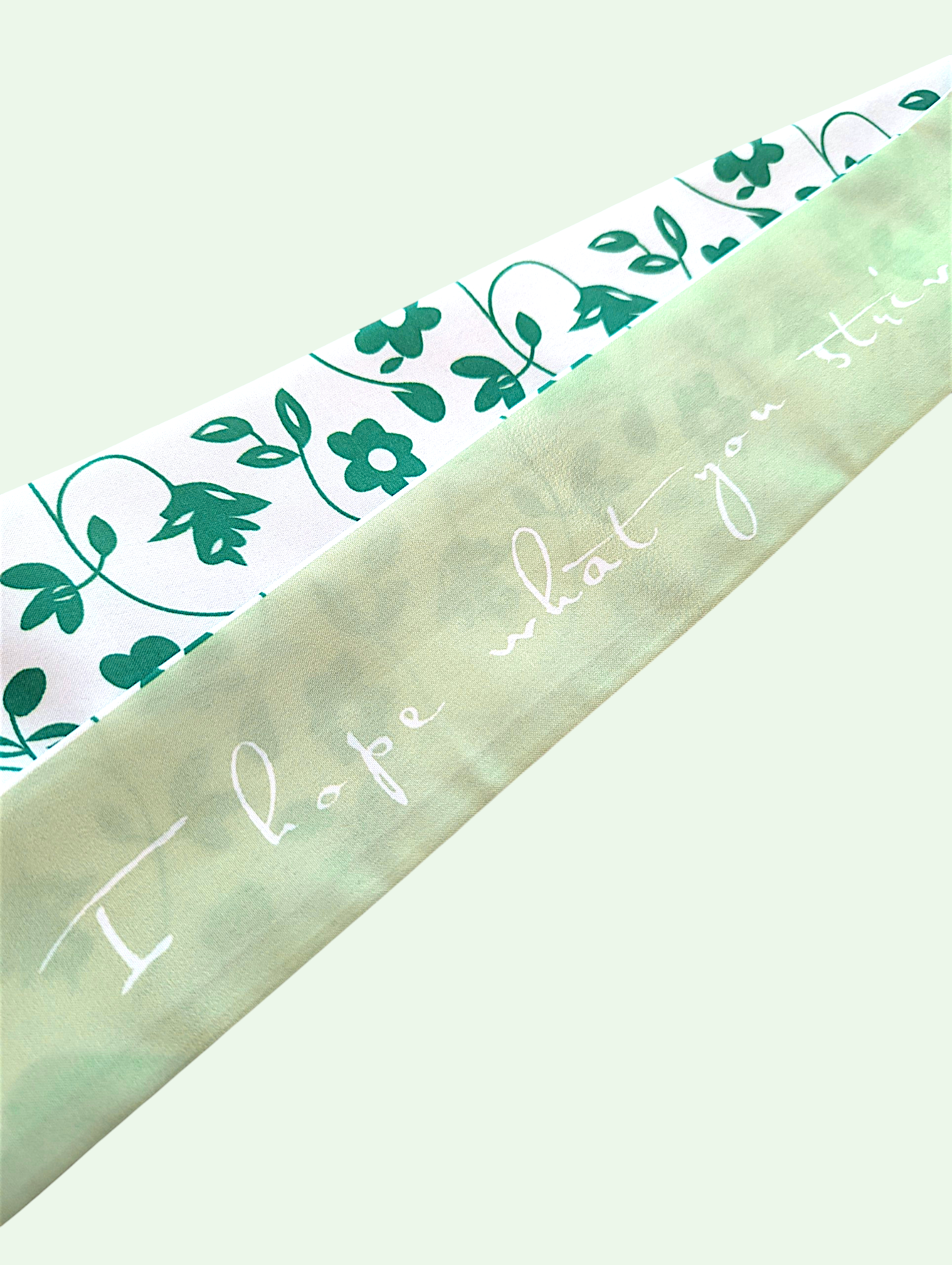 Green floral-patterned paper with 'I hope what you see' text on a white background