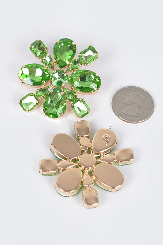 floral earrings next to a quarter, showing just how big they are. trust us. they're BIG. 