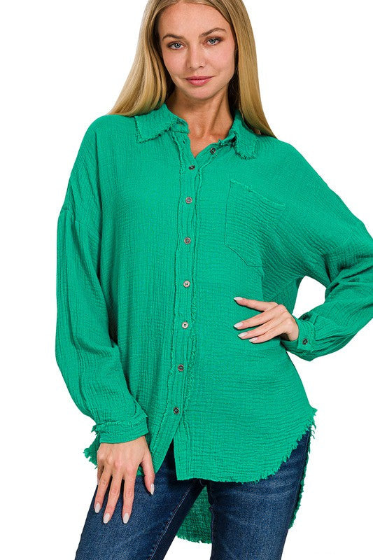a sassy blonde model stands, hand on hip, wearing the gauze long sleeve shirt buttoned up