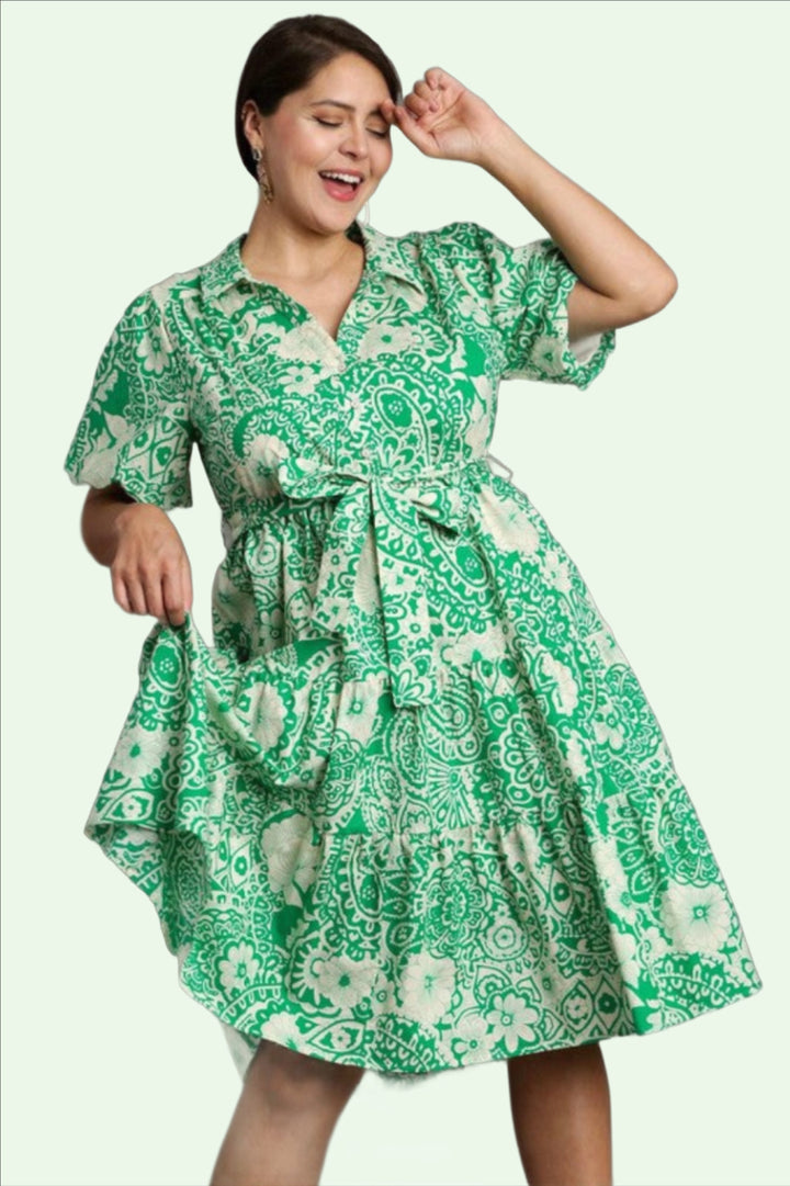 a dark haired model looks swingy in the the green floral shift dress