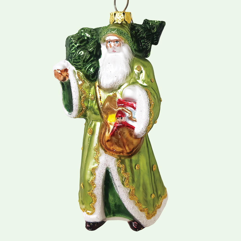Decorative Christmas ornament of a green-robed figure with a bag of toys, surrounded by stars on a white background.