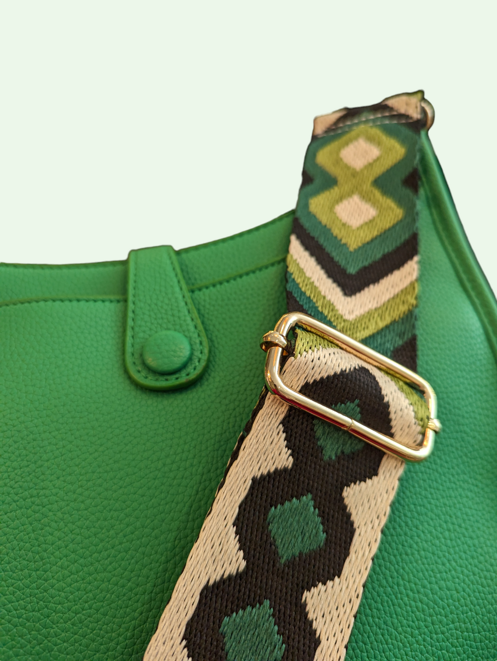 a detail of the colorful strap on the guitar strap crossbody