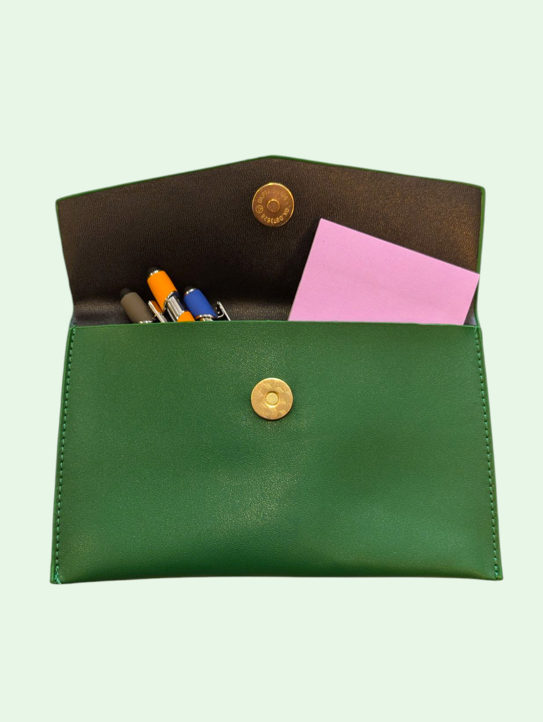 `a shot of the faux leather pouch with office supplies and such 