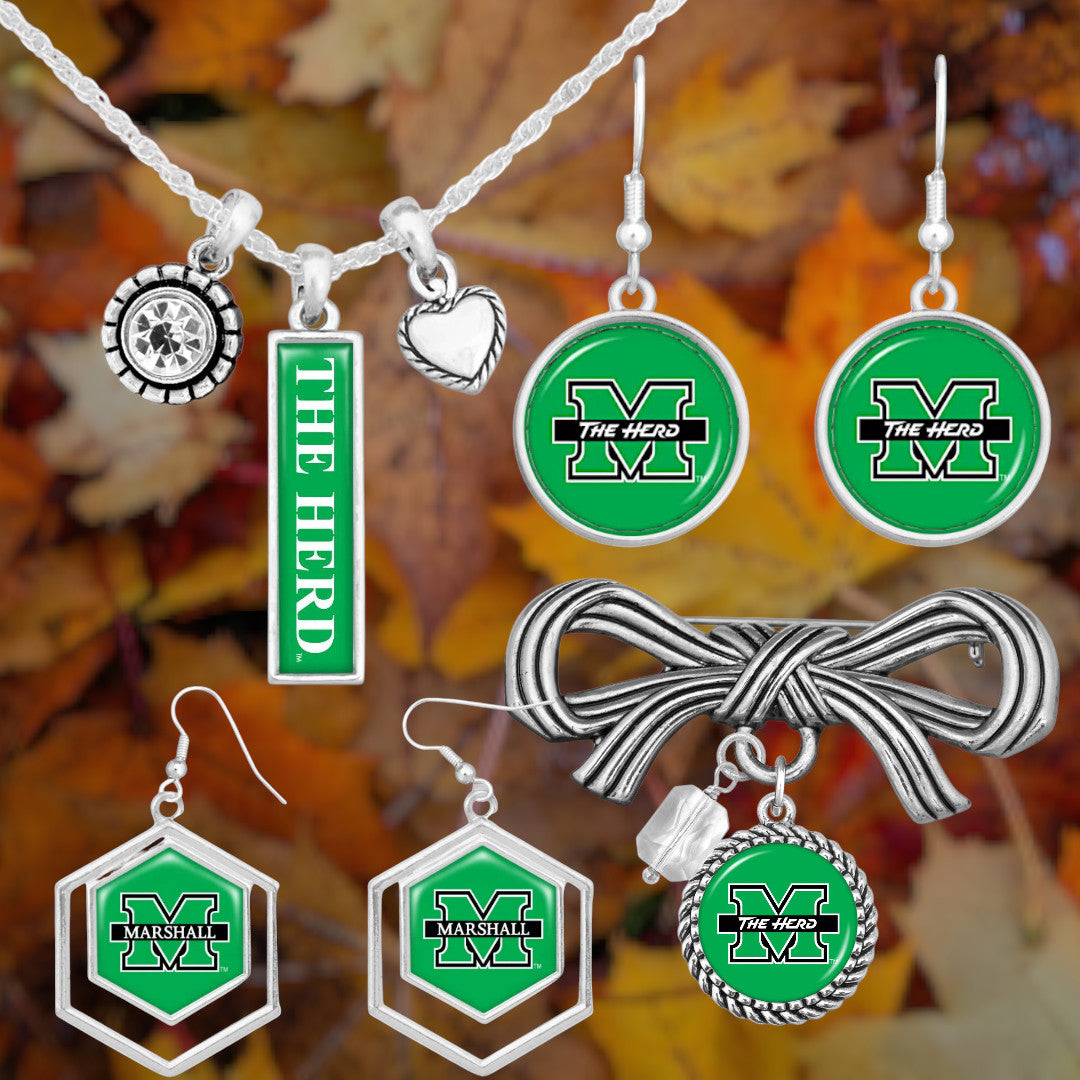 Jewelry set with green and silver 'The Herd' branding on a leafy background