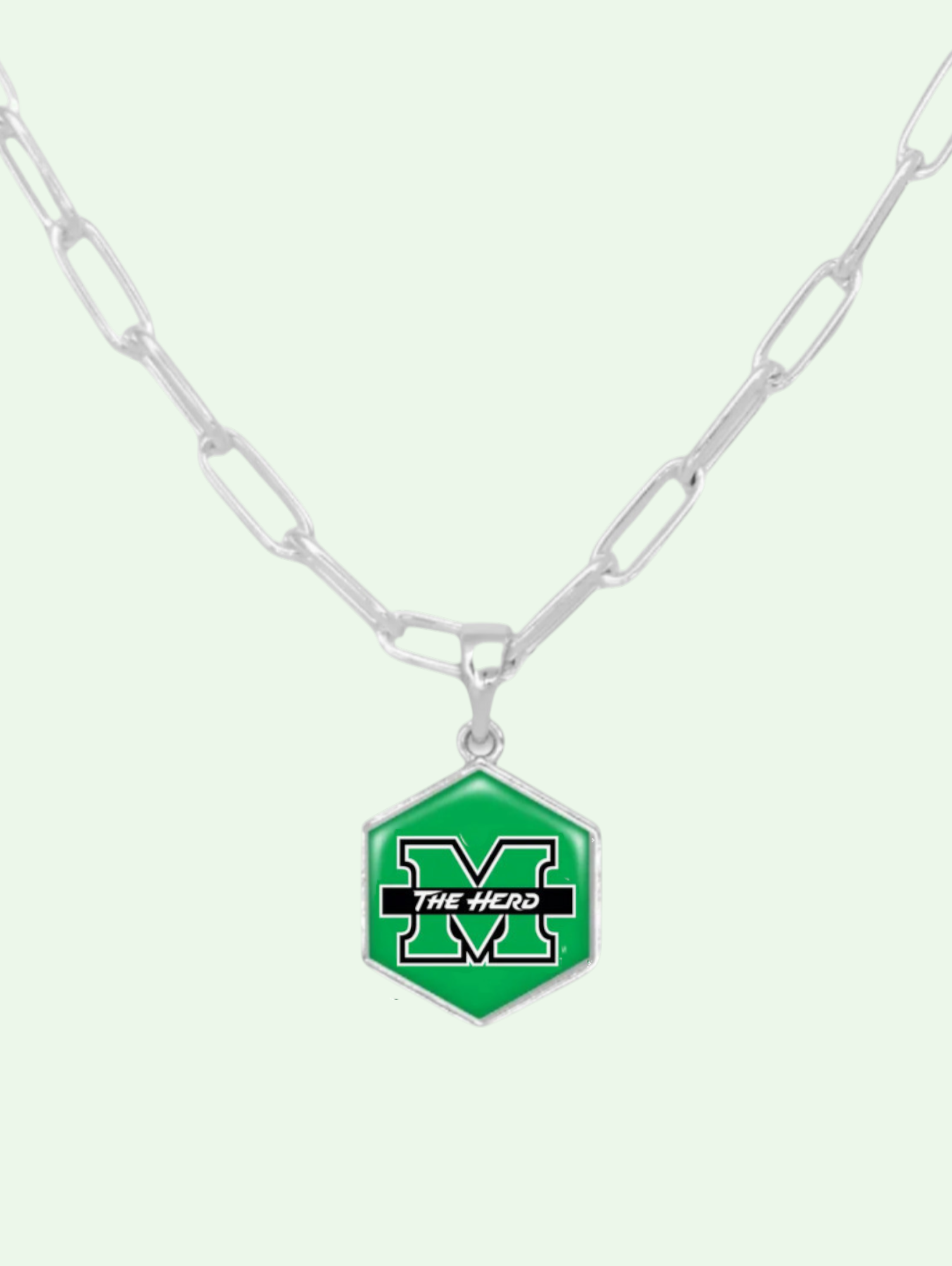 Necklace with a green hexagonal pendant featuring 'The Herd' logo on a white background