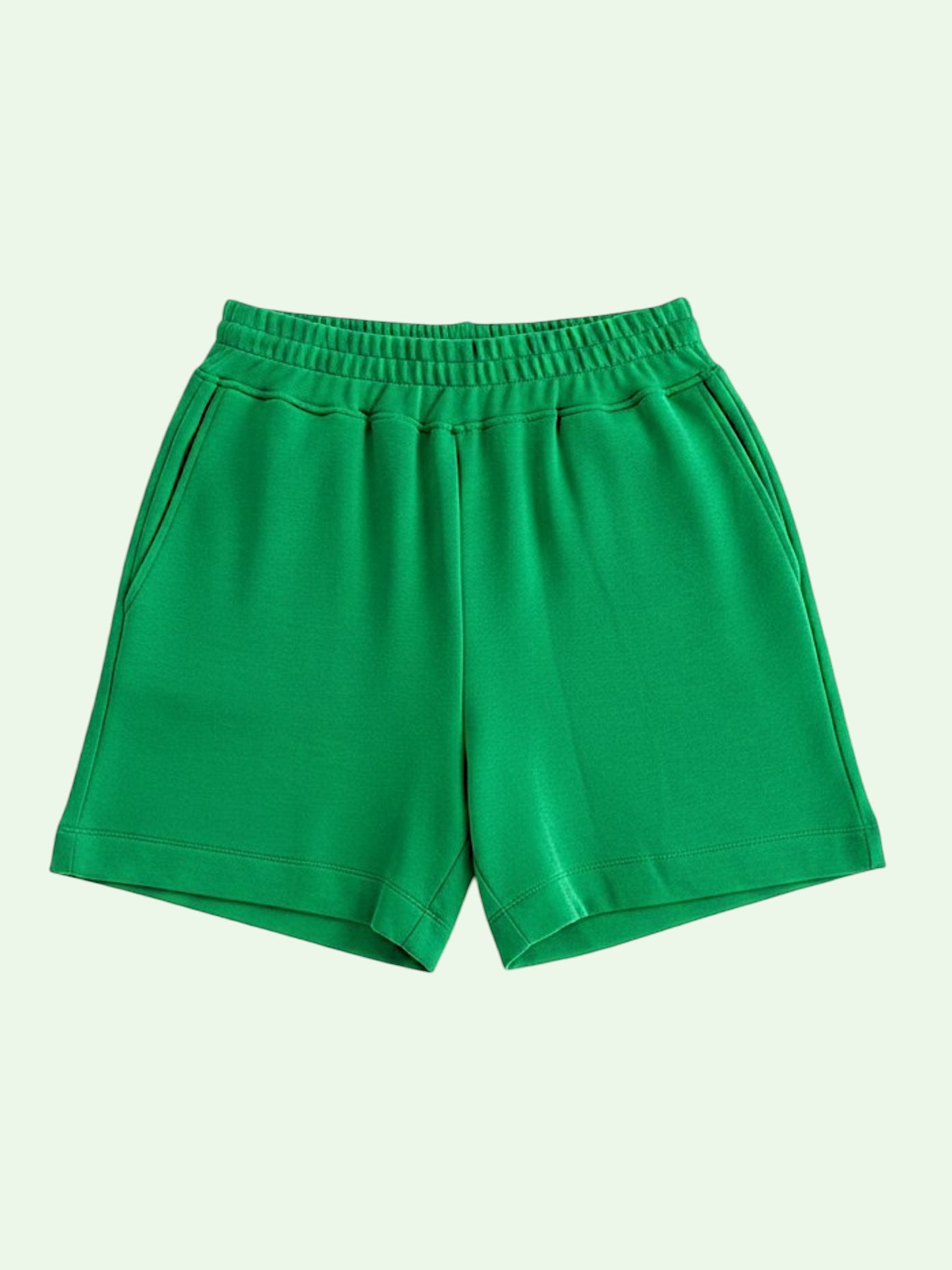 Green shorts on a light green background