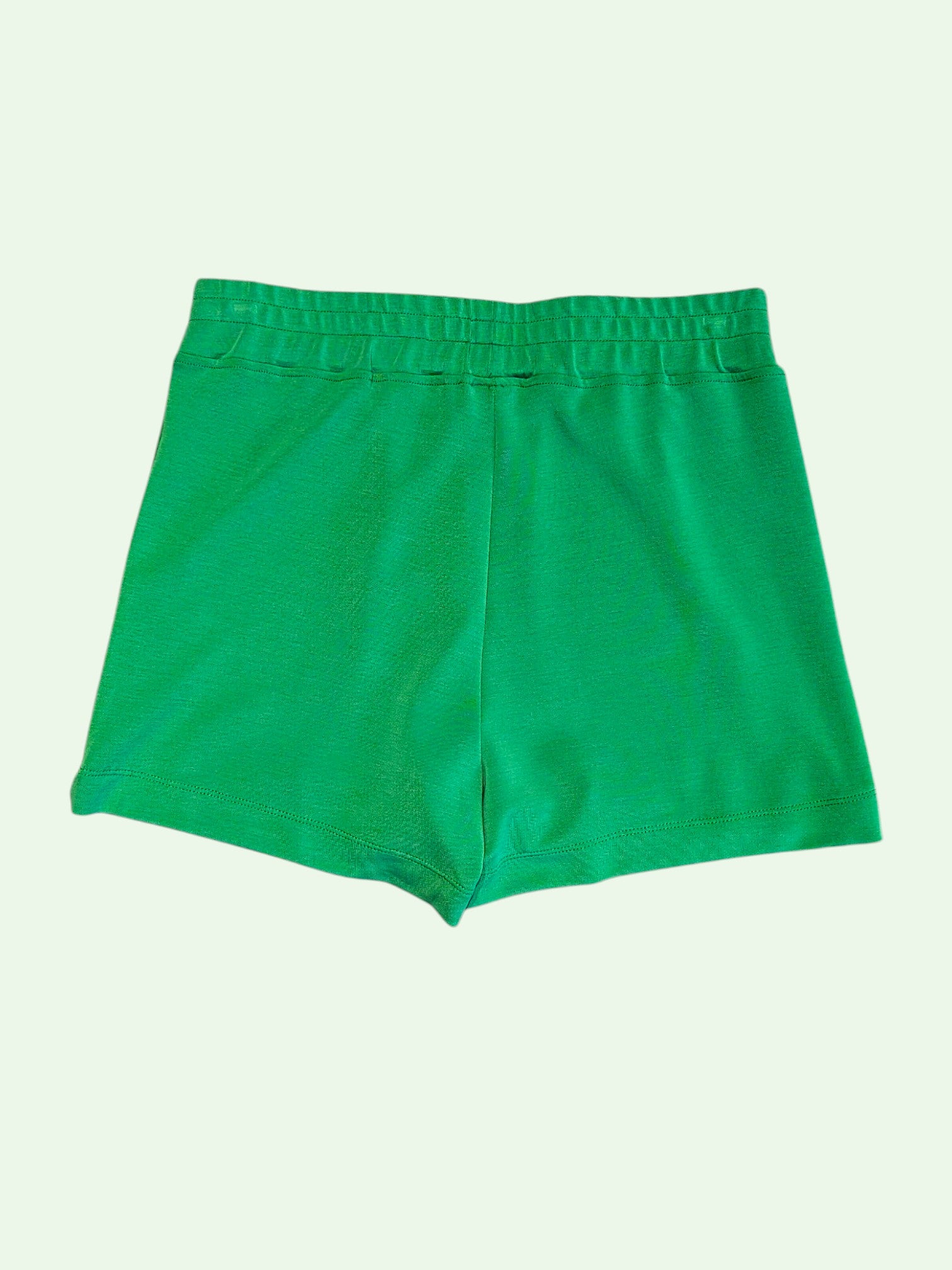 Green shorts on a green
 background