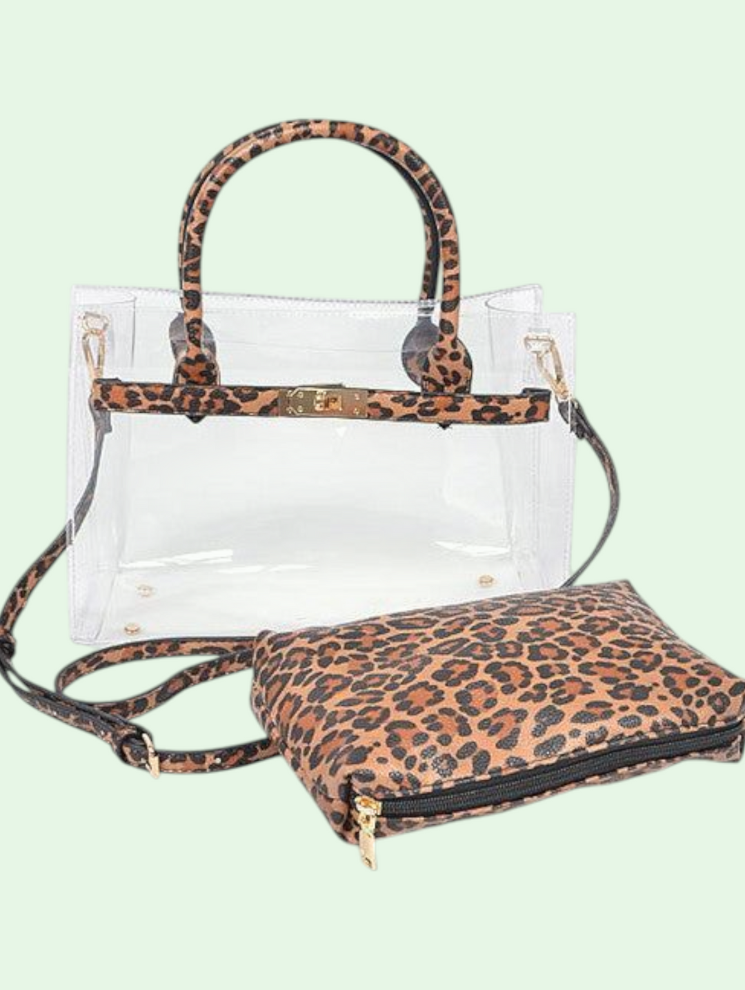 Clear handbag with leopard print handle and matching pouch on a light green background