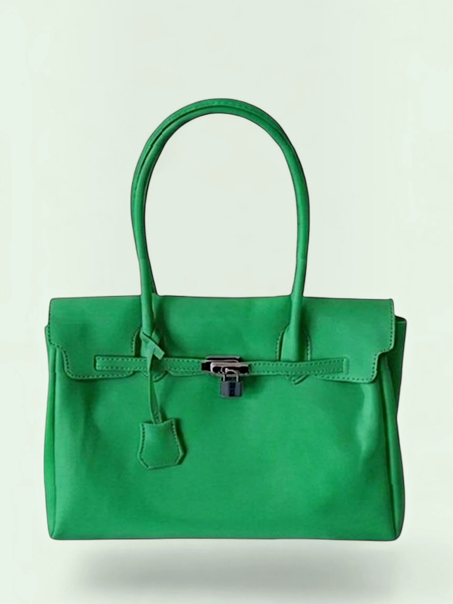 A vibrant green plastic handbag with double top handles, a front flap, and a silver-toned padlock closure, shown against a light off-white background.
