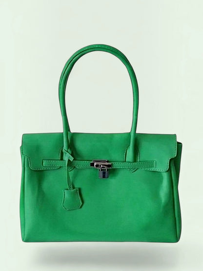 A vibrant green plastic handbag with double top handles, a front flap, and a silver-toned padlock closure, shown against a light off-white background.