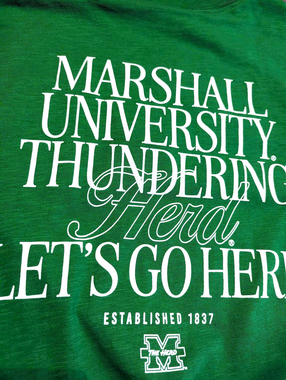 Green t-shirt with white text 'Marshall University Thundering Herd Let's Go Her' on a green background